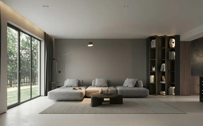 Bright, modern living room with a large window and grey sofa